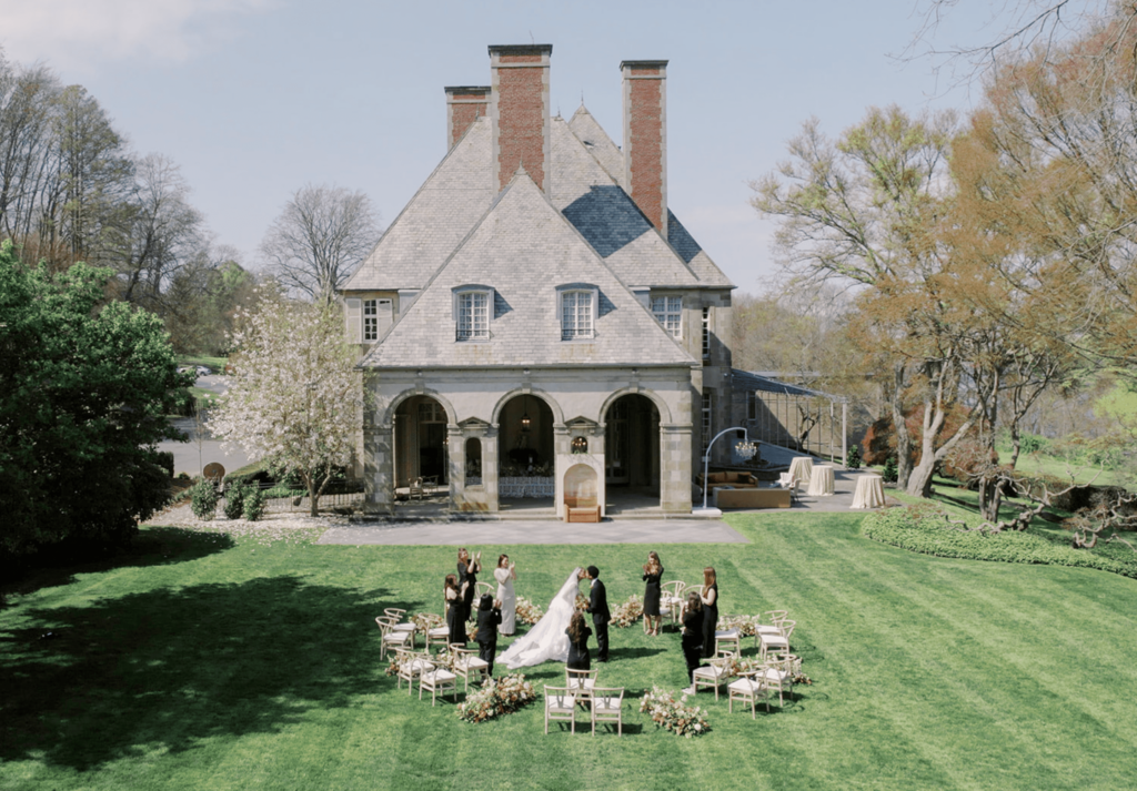 Intimate outdoor wedding ceremony on the lawn of Glen Manor House with circular seating